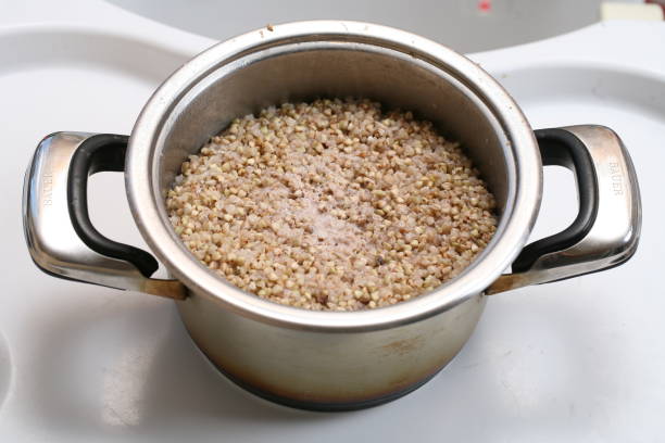 A pot filled with cooked buckwheat grains.