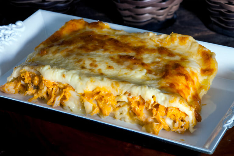 Delicious layered chicken lasagna on a white plate