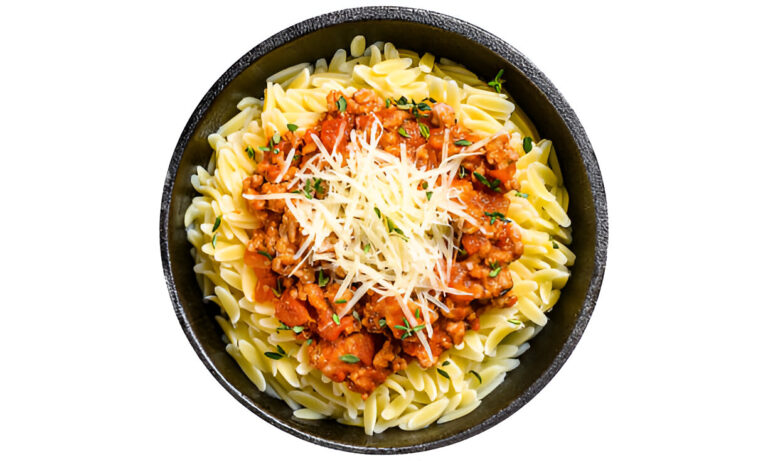 A bowl of rotini pasta topped with a meat sauce and grated cheese.